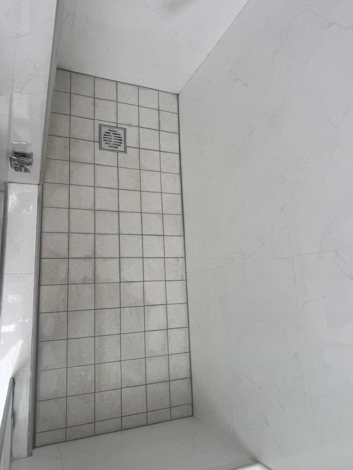 New shower floor and drain detail after conversion