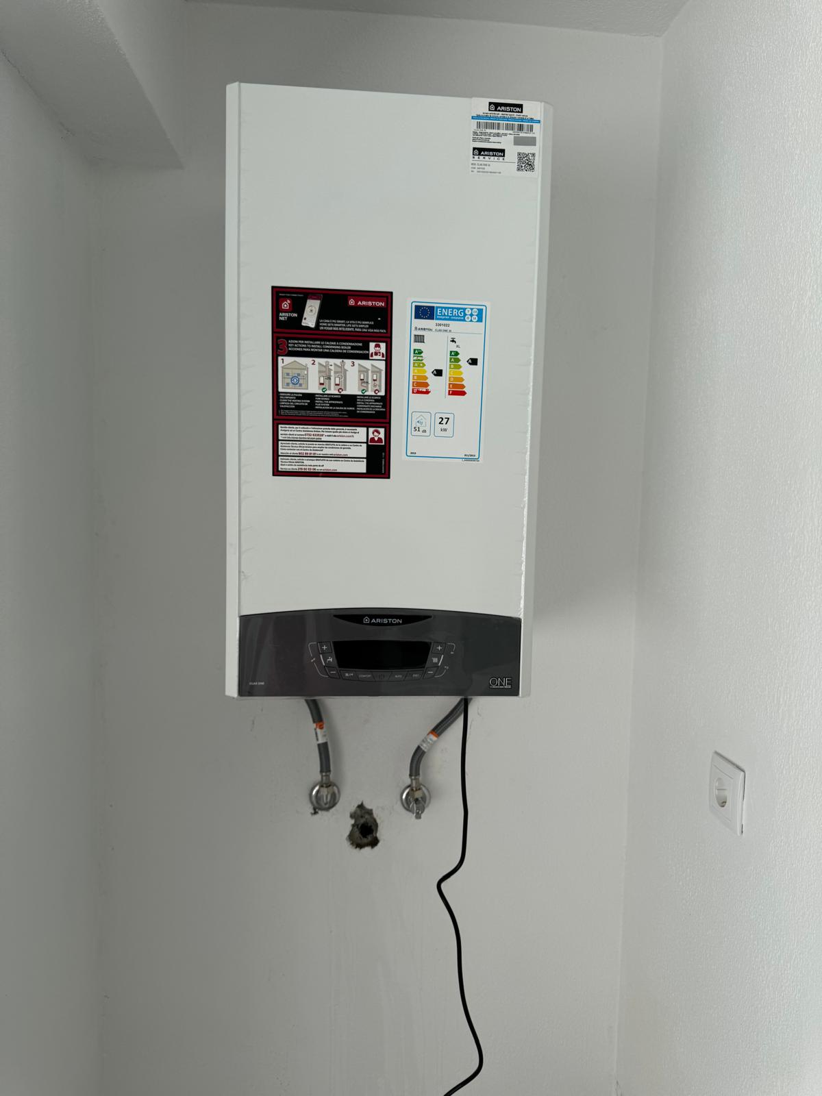 Installed gas boiler mounted on the wall
